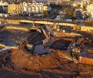 https://www.railadvent.co.uk/wp-content/uploads/2022/02/Efforts-to-temporarily-divert-the-Dawlish-river-water-as-part-of-work-on-the-new-stilling-basin-is-ongoing-750x422.jpg